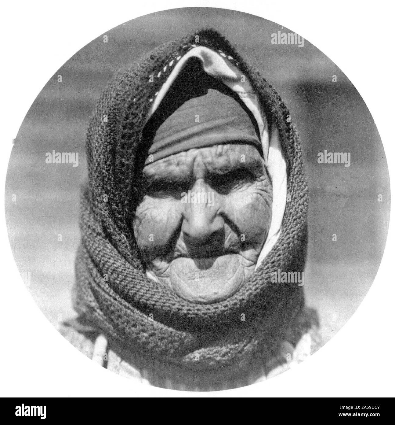 Old Greek woman in camp at Salonica waiting to be moved to Thrace Stock Photo