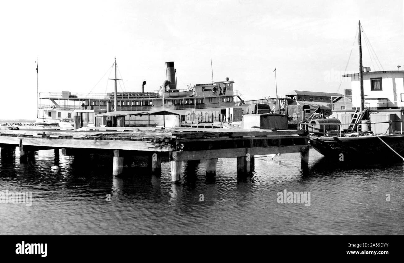 This photograph depicts the Steamer Block Island at landing in Plum