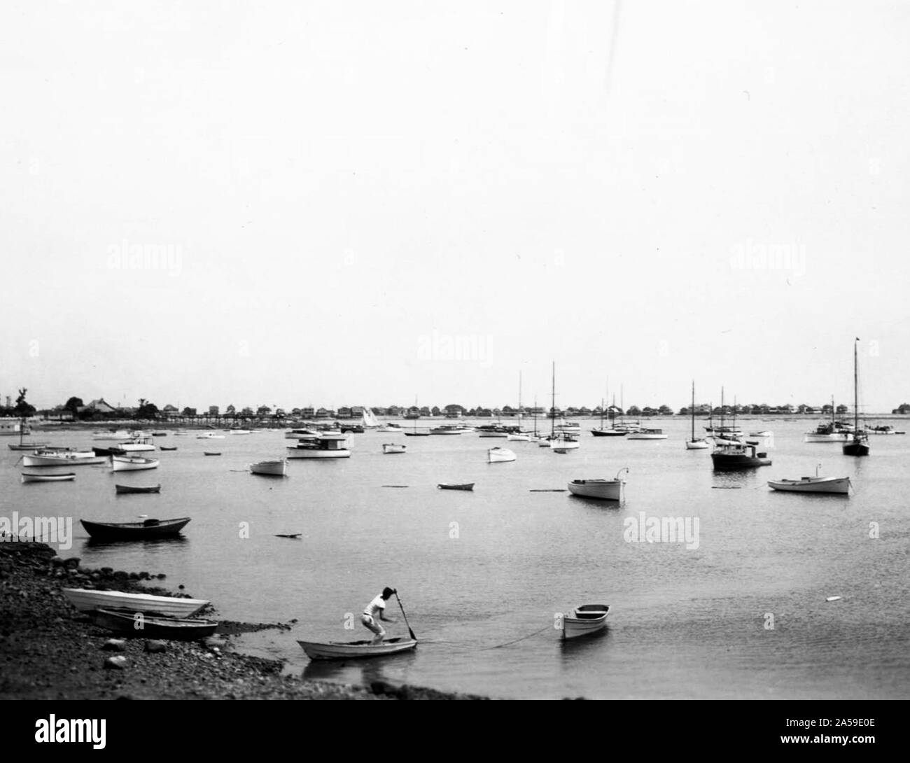 This photograph depicts Scituate Harbor in Massachusetts scattered with