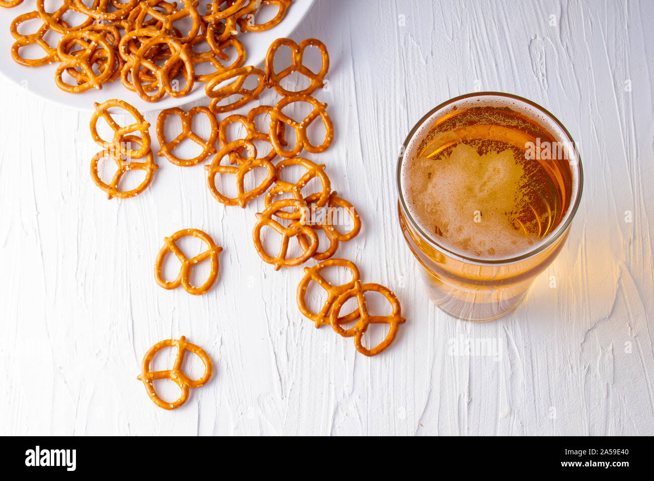 Top view of a Beer and pretzels on a white background Stock Photo