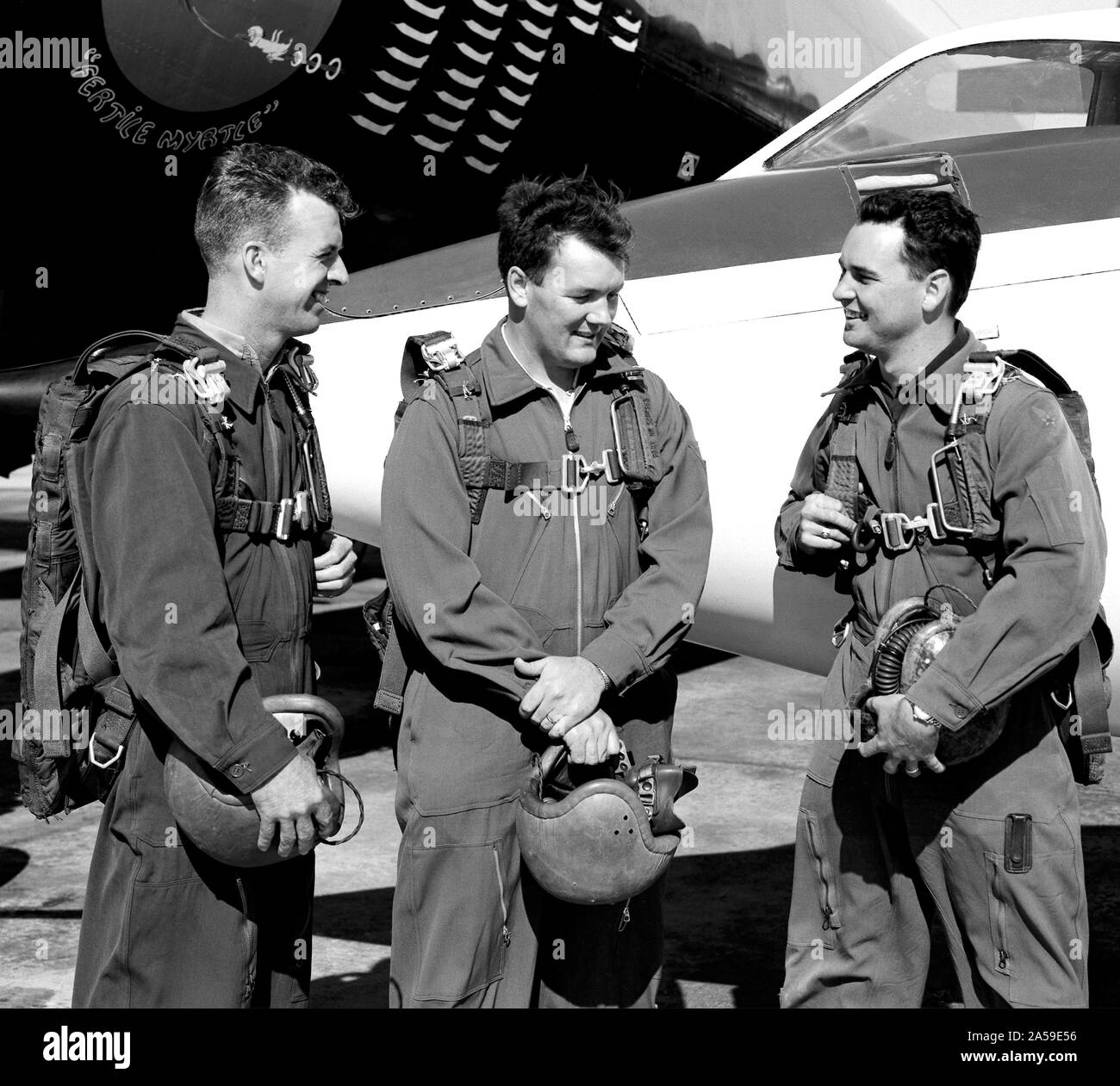 This photo shows test pilots, (Left-Right) Joseph A. Walker, Stanley P. Butchart and Walter P. Jones, standing in front of the Douglas D-558-II Skystreak, in 1952. These three test pilots at the National Advisory Committee for Aeronautics’ High-Speed Flight Research Station probably were discussing their flights in the aircraft. Stock Photo