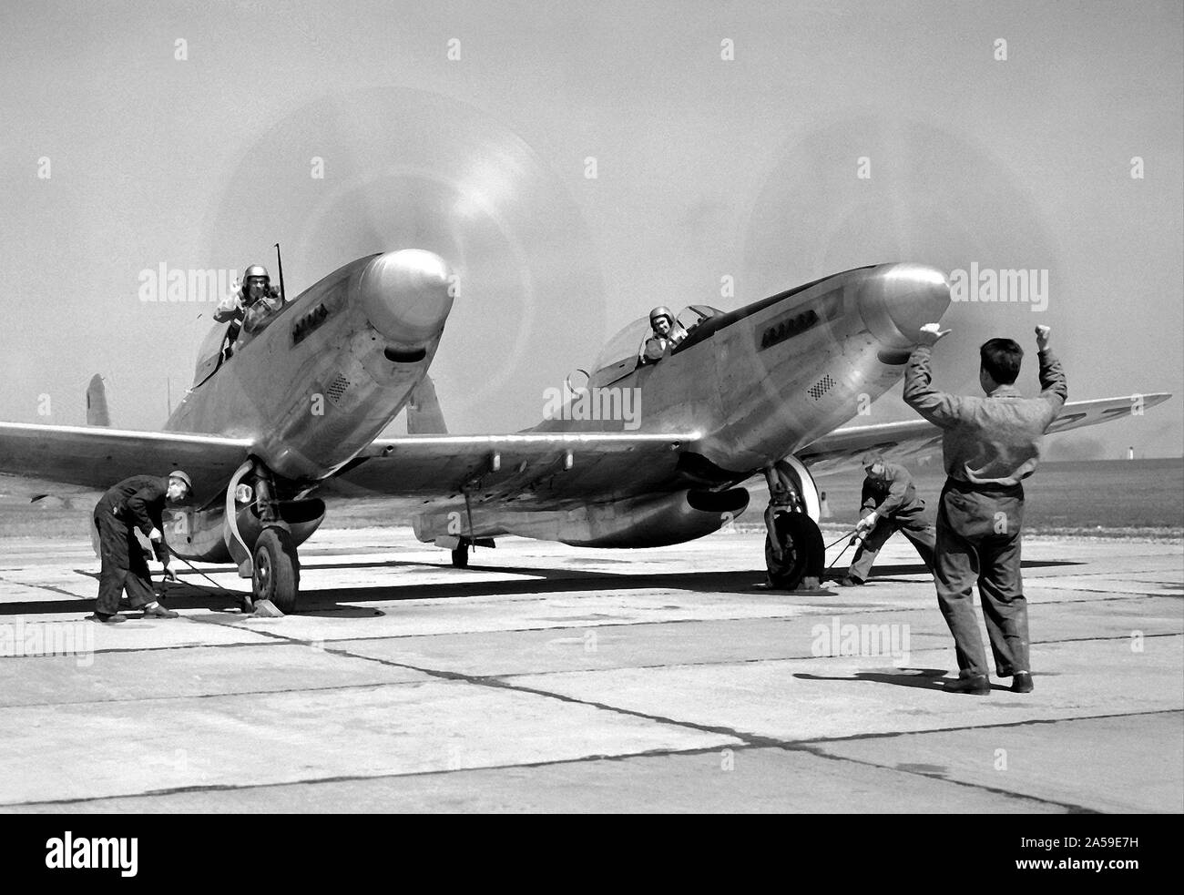Pilot William Swann, right cockpit, prepares the North American XF-82 Twin Mustang for flight at the National Advisory Committee for Aeronautics (NACA) Lewis Flight Propulsion Laboratory. Stock Photo