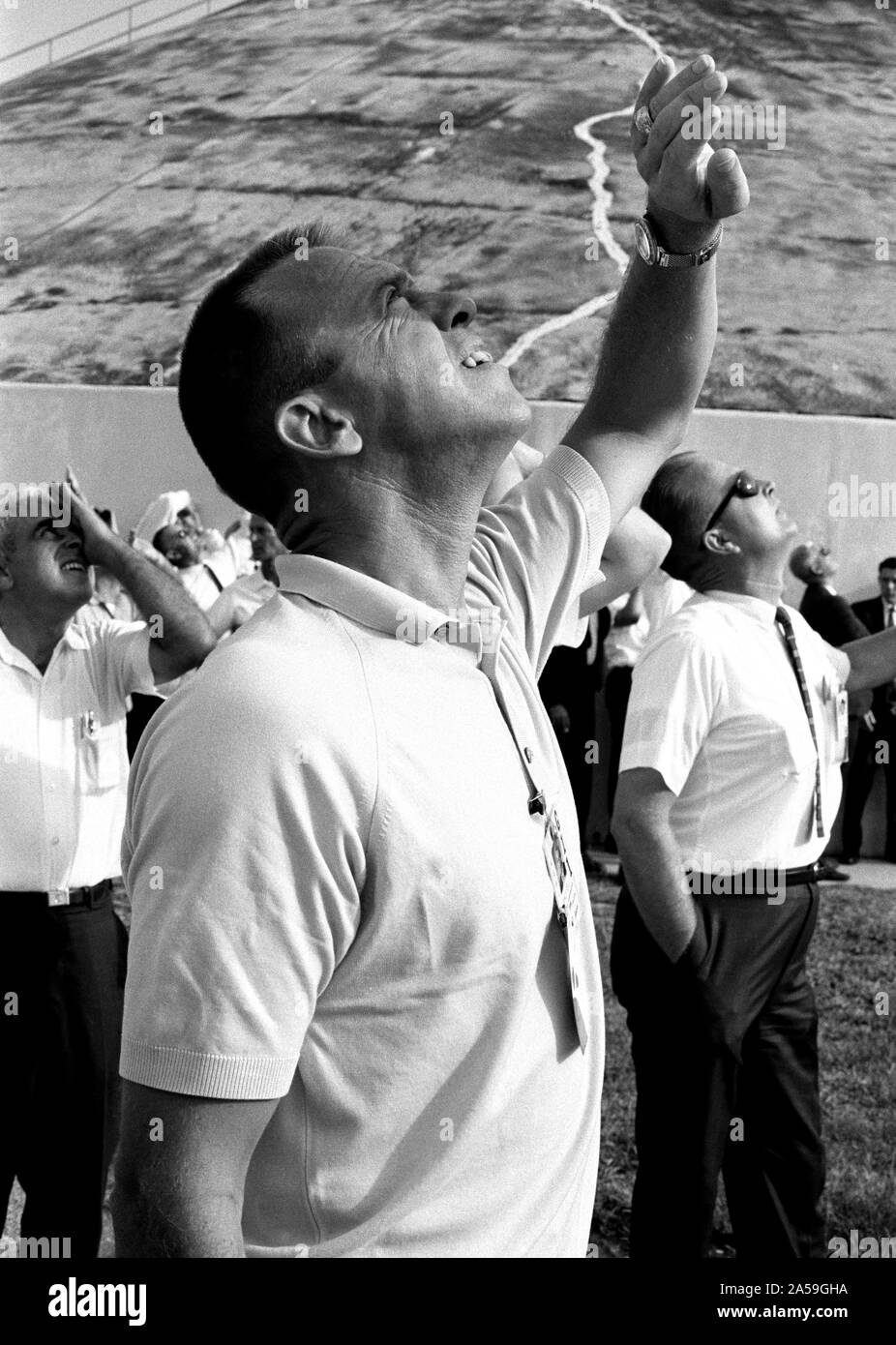 (12 Sept. 1966) --- Astronaut Alan B. Shepard Jr., Chief, MSC Astronaut Office, shields his eyes from the sun as he follows the Gemini-11 liftoff. Stock Photo