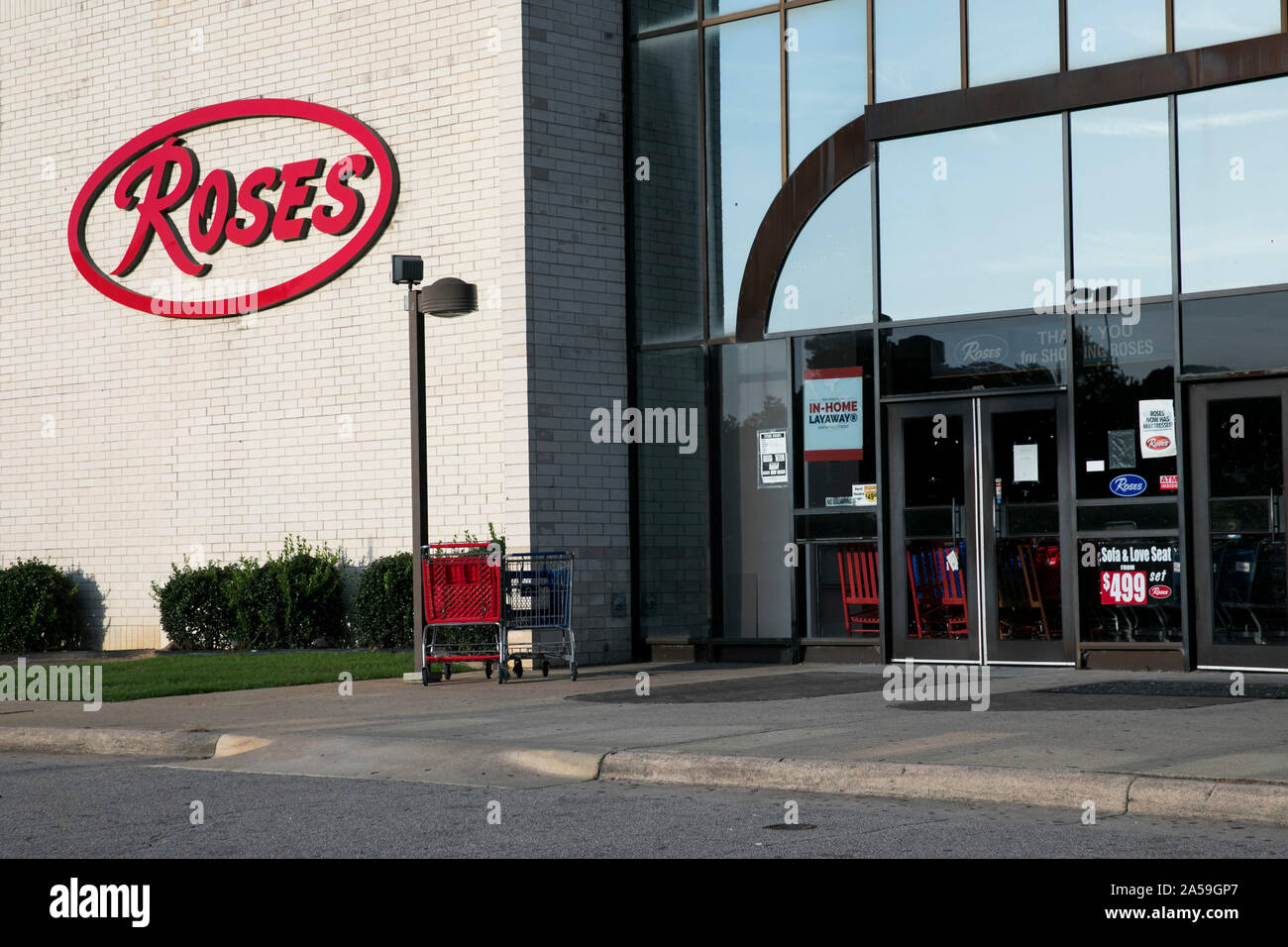 A logo sign outside of a Roses retail store location in Wilson, North Carolina on September 14