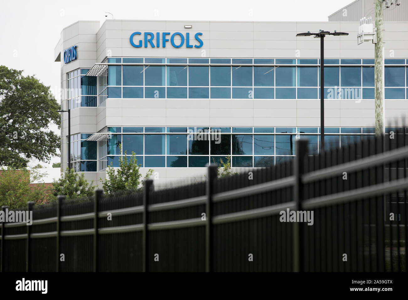 A logo sign outside of a facility occupied by Grifols in Clayton, North Carolina on September 14, 2019. Stock Photo