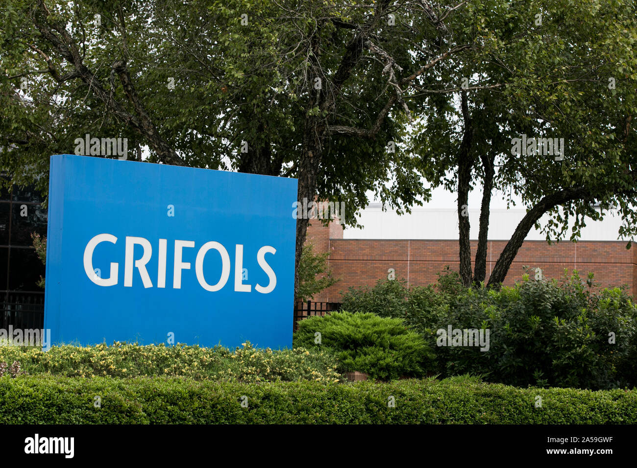 A logo sign outside of a facility occupied by Grifols in Clayton, North