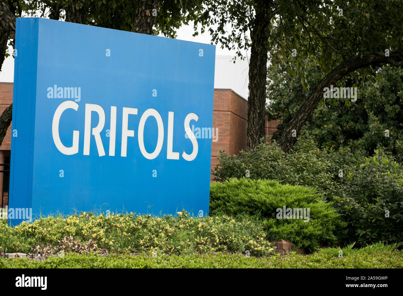 A logo sign outside of a facility occupied by Grifols in Clayton, North