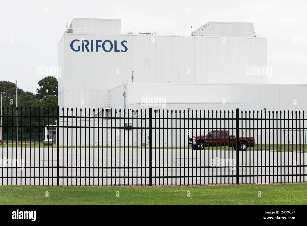 A logo sign outside of a facility occupied by Grifols in Clayton, North