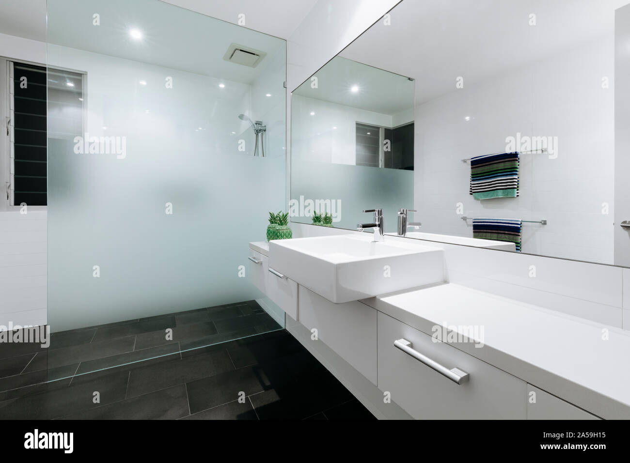 Beautiful white bathroom in new luxury home Stock Photo Alamy