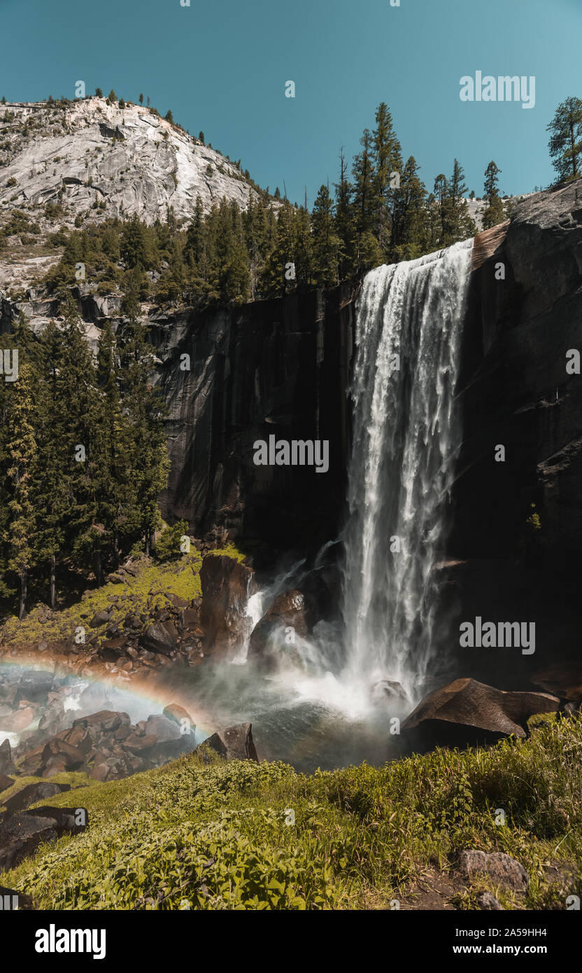 Yosemite National Park Nevada Waterfall in California with Rainbow Stock Photo