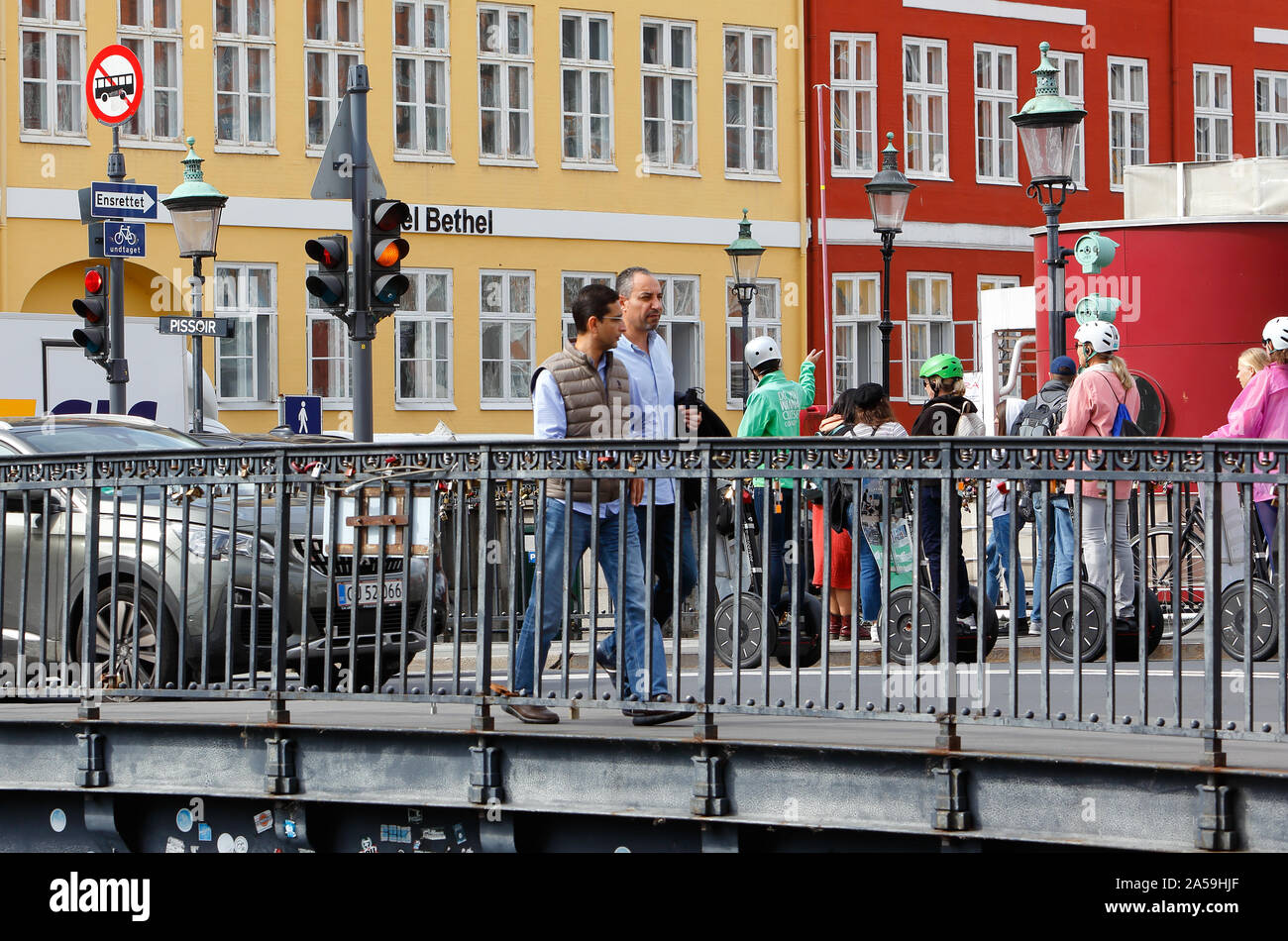 Copenhagen, Denmark - September 4, 2019: People walking the Nyhavn bridge. Stock Photo