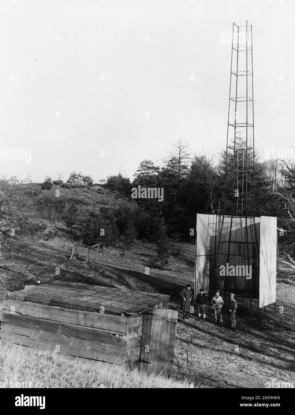 Dr. Robert H. Goddard's tower and shelter at the Army artillery range at Camp Devens, in Ayer, Massachusetts in the winter of 1929-1930. Goddard originally began testing rockets on his aunt's farm in Auburn, Massachusetts until the local police, fire department and townspeople became concerned about the noise and menace to the public the rockets created. Stock Photo