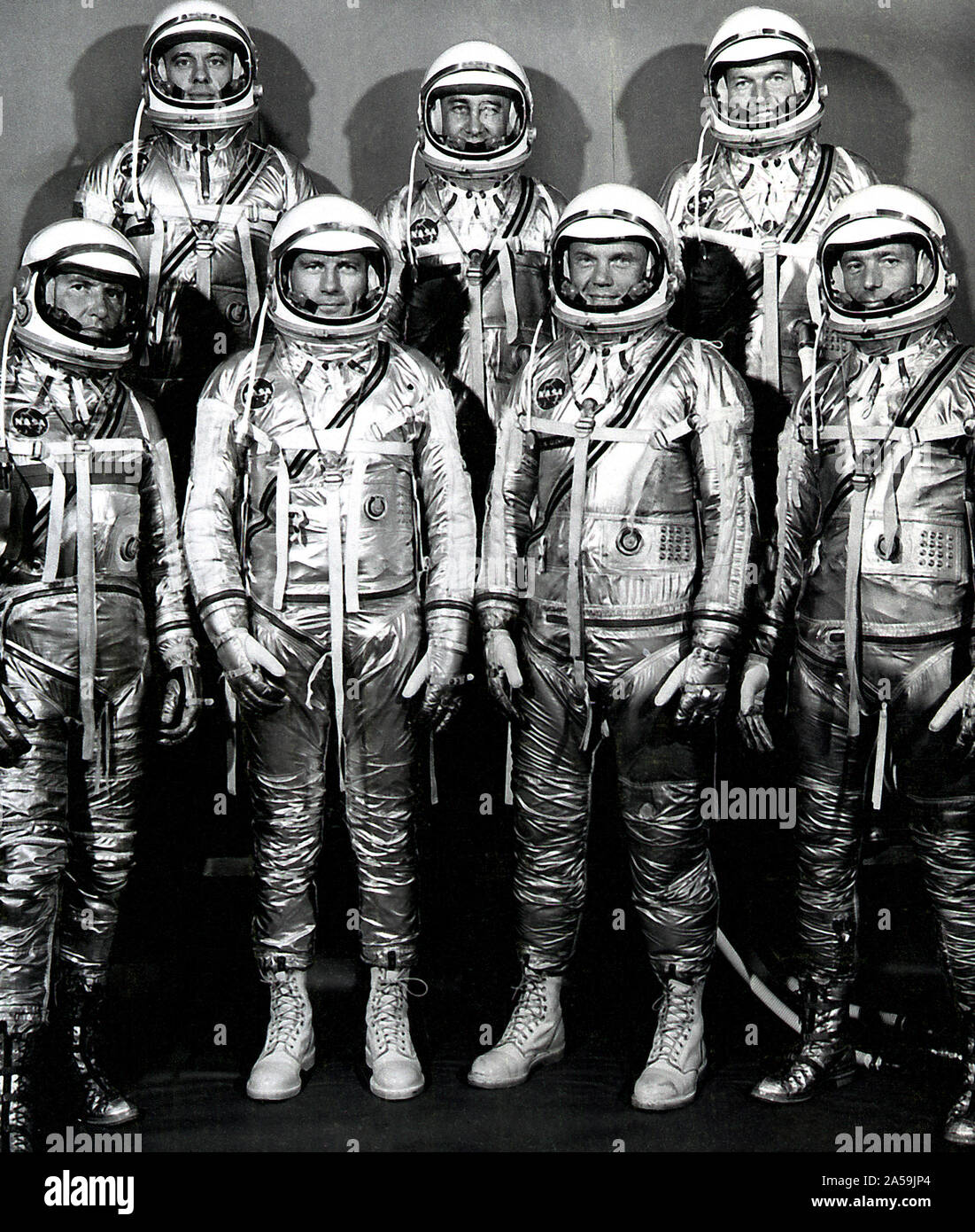 The group portrait of the original seven astronauts for the Mercury Project. NASA selected its first seven astronauts on April 27, 1959. Left to right at front: Walter M. Wally Schirra, Donald K. Deke Slayton, John H. Glenn, Jr., and Scott Carpenter. Left to right at rear: Alan B. Shepard, Virgil I. Gus Grissom, and L. Gordon Cooper, Jr. Stock Photo