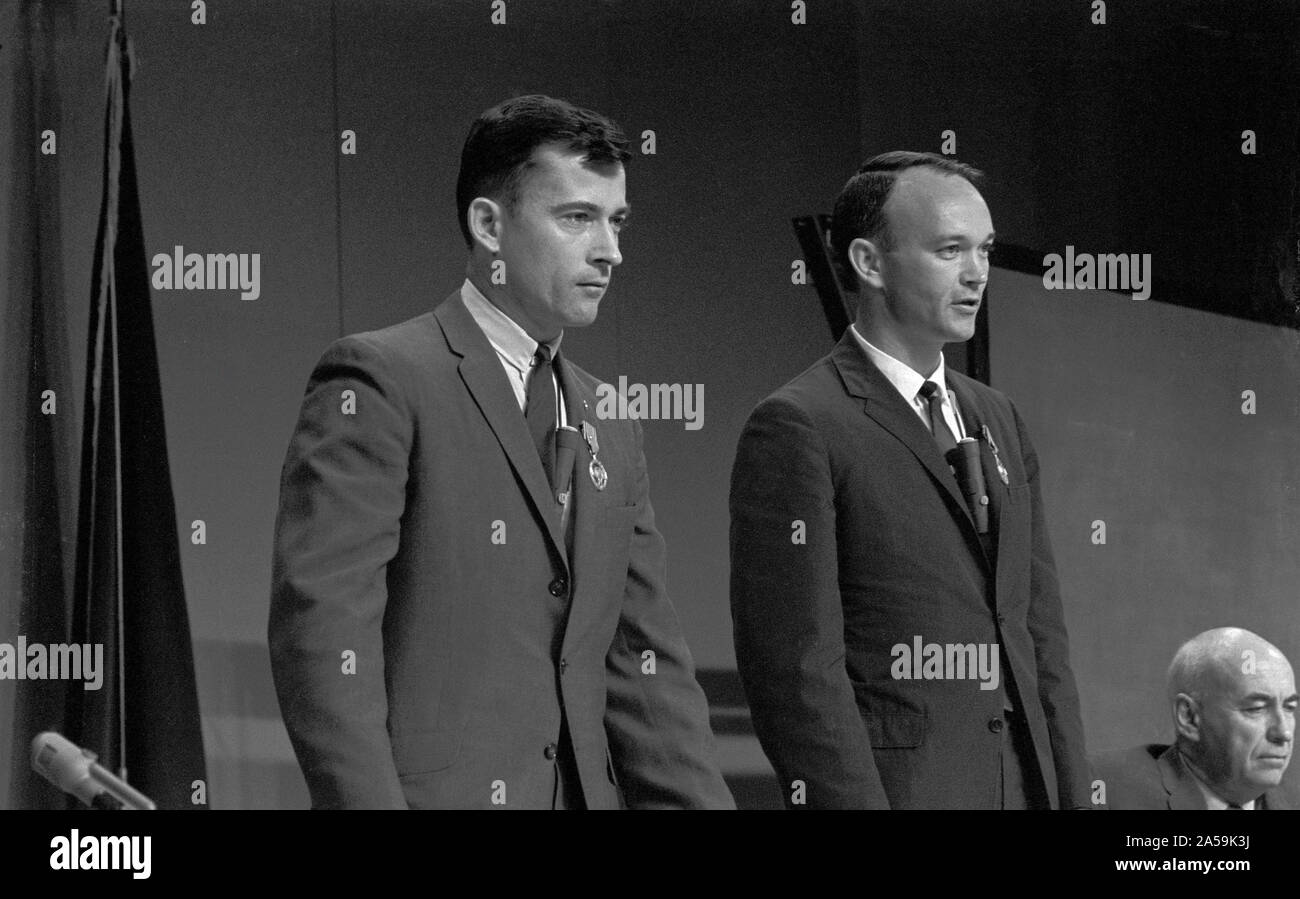 (1 Aug. 1966) --- Astronaut John W. Young (left), command pilot, and Michael Collins, pilot, the prime crew of the Gemini-10 spaceflight, wear the National Aeronautics and Space Administration's Exceptional Service Medal awarded them during ceremonies preceding the Gemini-10 press conference. Stock Photo