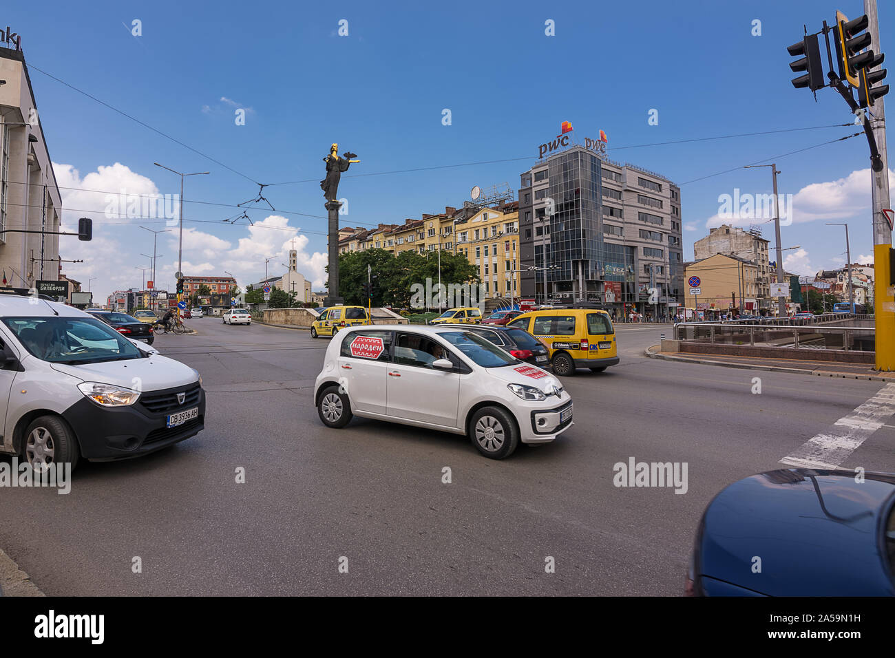 Sofia, Bulgaria - June 25, 2019: Road junction and traffic in the center of Sofia with the Statue of Saint Sophia, symbol of wisdom and protector of S Stock Photo