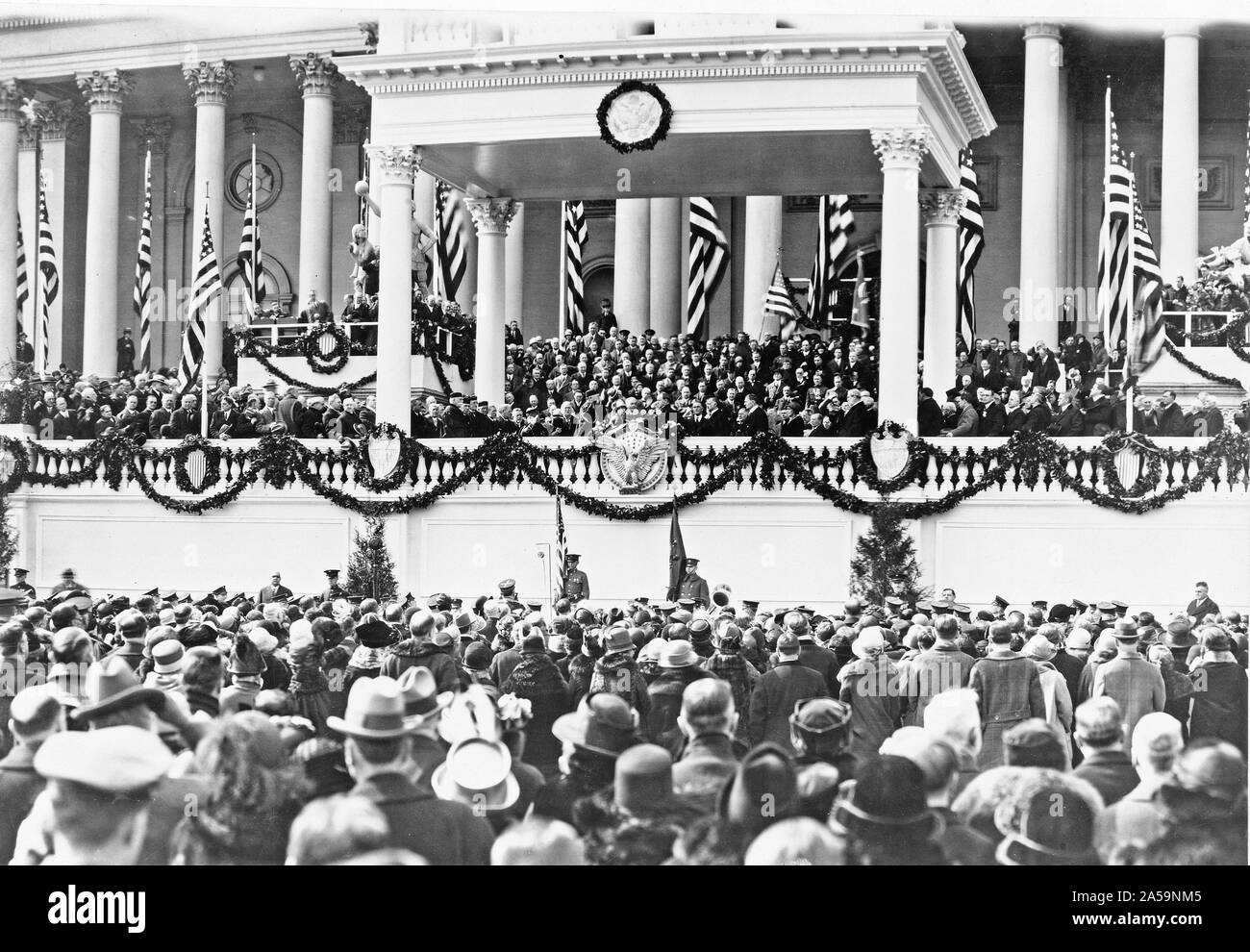 Chief Justice William H. Taft administering the oath of office to Calvin Coolidge on the east portico of the U.S. Capitol, March 4, 1925 Stock Photo