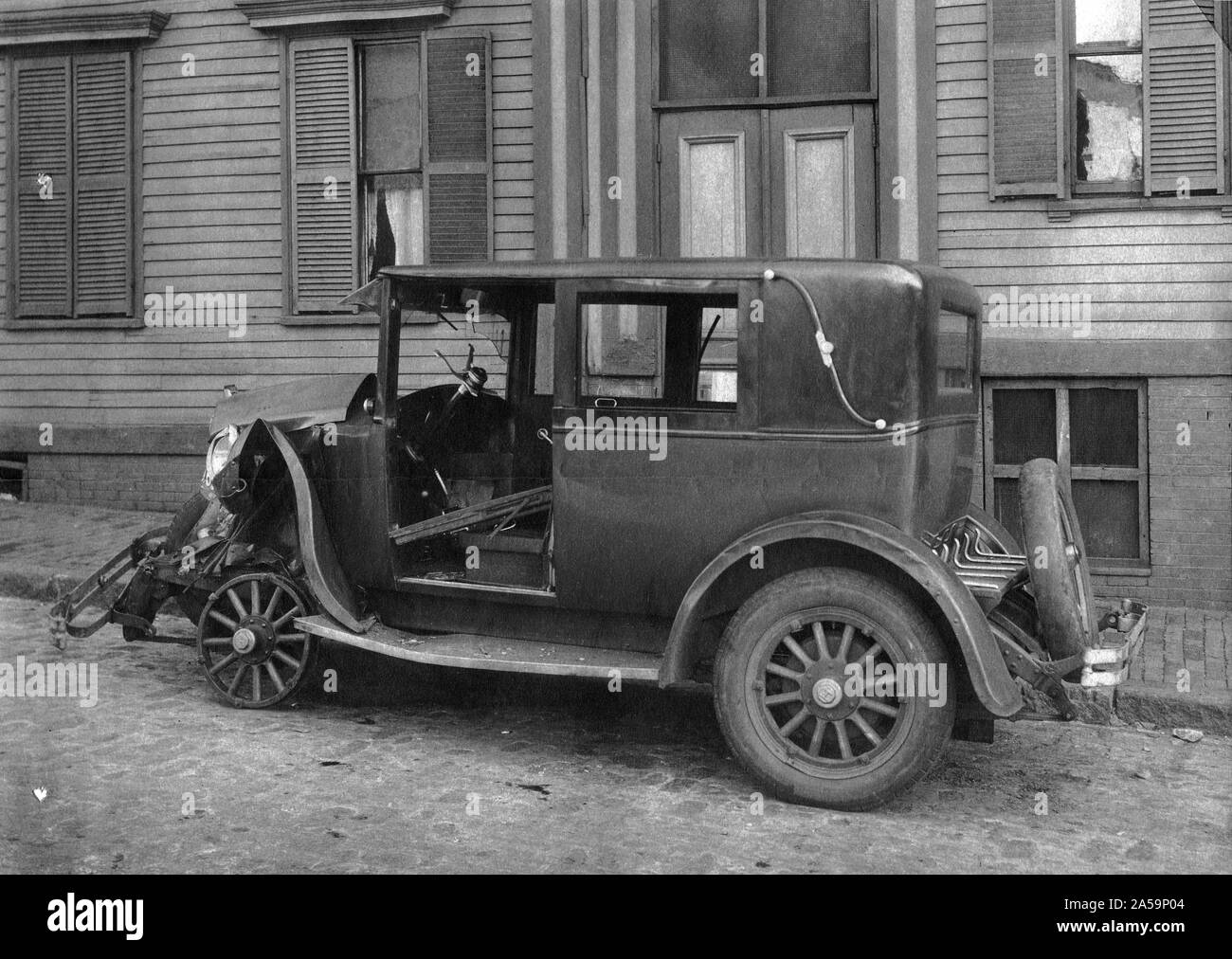 This photograph is a view of the left side of the wrecked automobile. 1927 Stock Photo