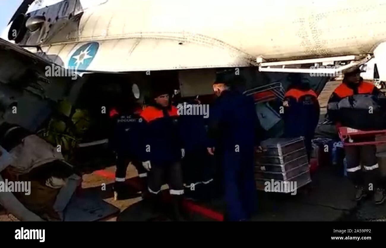 St. Petersburg. 19th Oct, 2019. Video screenshot shows staff members of the Russian Emergencies Ministry heading for a collapsed dam in the Kuraginsky district of Russia's Krasnoyarsk region, Oct. 19, 2019. At least six people were killed and 14 others injured after a dam collapsed in the Kuraginsky district of Russia's Krasnoyarsk region on Saturday, local media reported. Credit: Xinhua/Alamy Live News Stock Photo