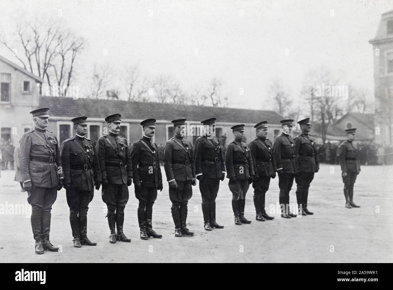 The New officers of the Legion of Honor and a Chevalier. The ceremony was held in the courtyard of American General headquarters at Chaumont for all recipients are American Officers. Left to right: Major General Hanson E. Ely, Brig. Gen. Wendell C. Neville, U.S. Marine Corps; Brig. Gen. Campbell King; Big. Gen. F.R. McCoy; Brig. Gen. L.R. Holbrook; Col. Carl Boyd; Col. Robert A. Brown; Col. J.A. Logan; Lt. Col P.H. Clark; . Robert Bacon; The Chevalier, Lt. James W. Wilson. Decorated by Marshal Petain. Stock Photo