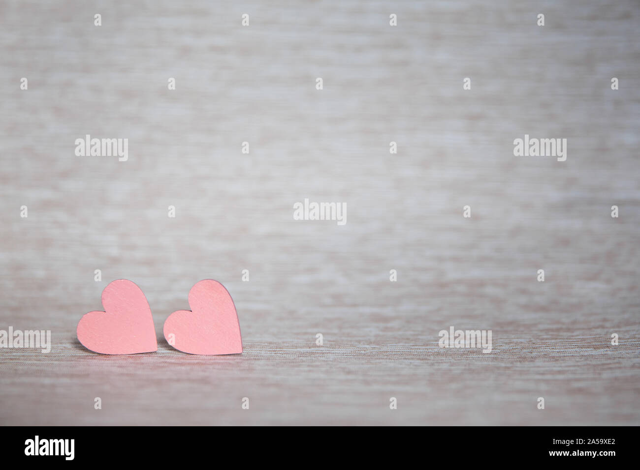 Two hearts. Background for congratulations with pink hearts. Valentine's Day. Stock Photo