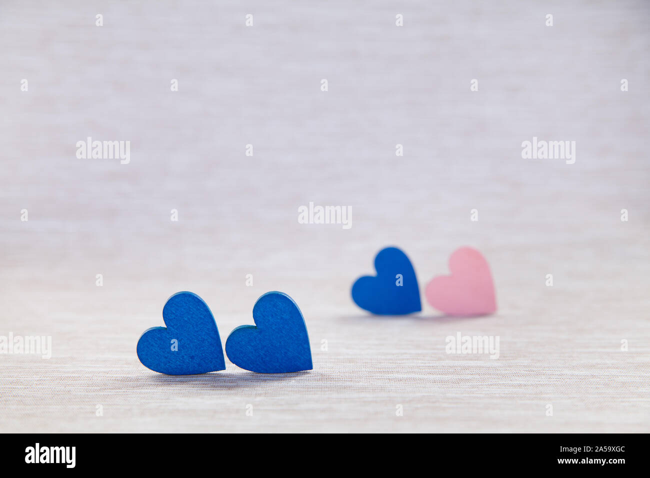 Wooden hearts on beautiful background. background for greetings on Valentine's Day. Blue hearts. Stock Photo