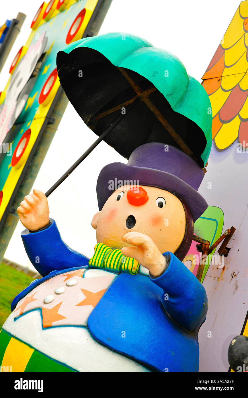 Little round cartoon man from the Noddy tableau in Blackpool annual  illuminations holding umbrella Stock Photo - Alamy
