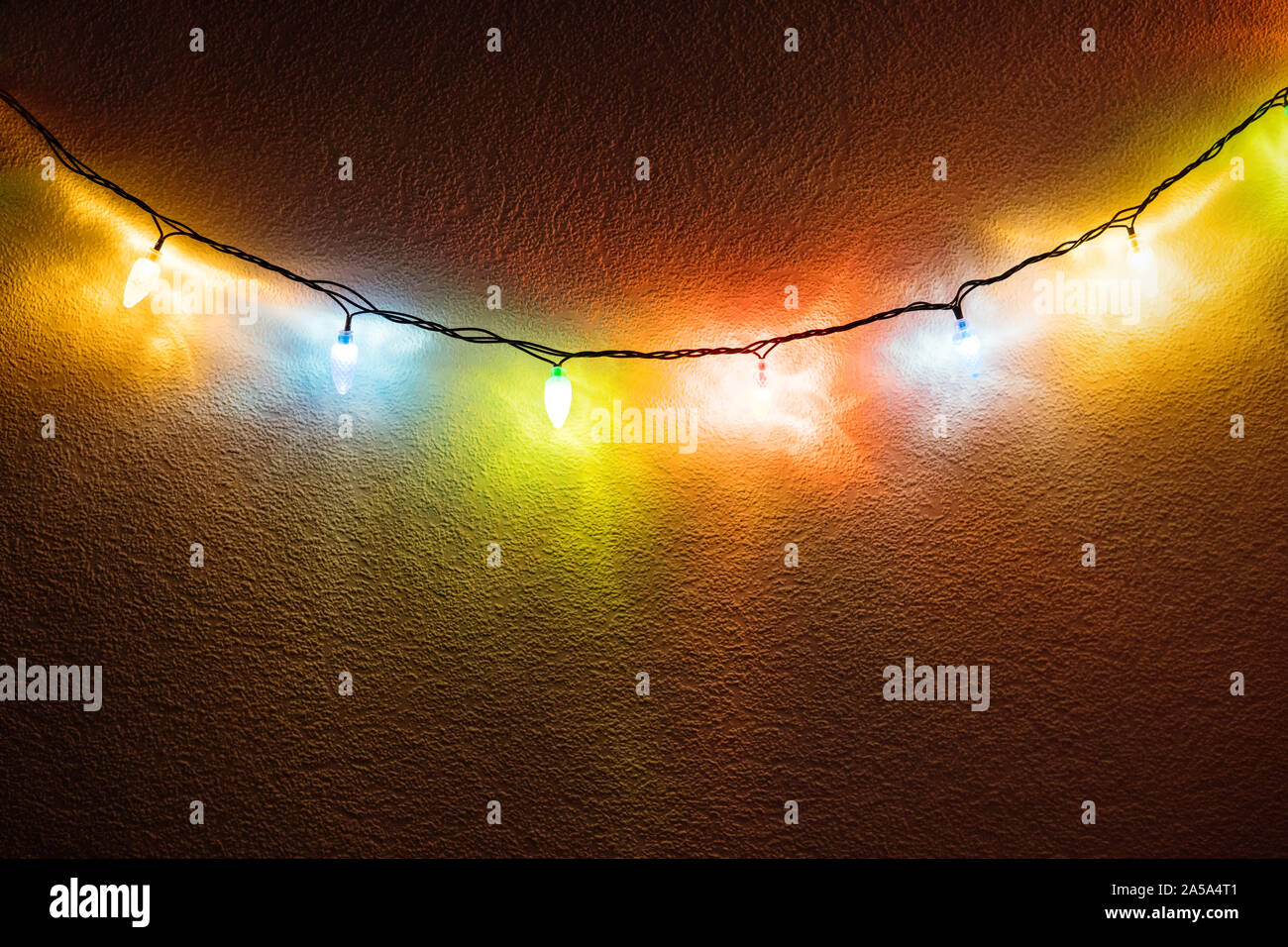 fancy christmas party lights hanging on the wall Stock Photo