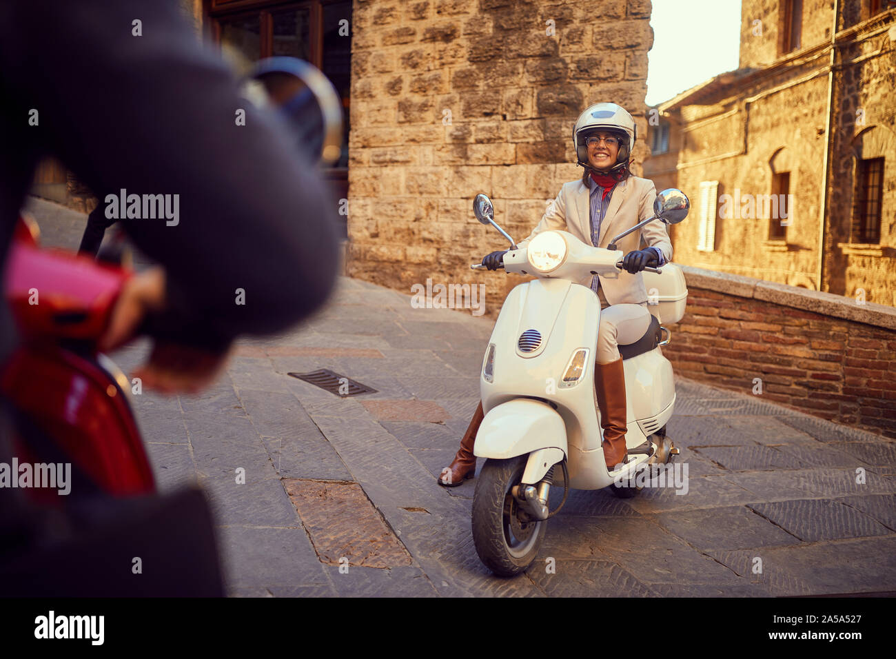 Young smiling girl on Vespa Scooter at 