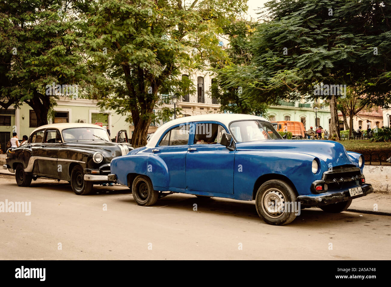 Street Scene with Vintage Classic American Cars, Havana, Cuba Stock Photo
