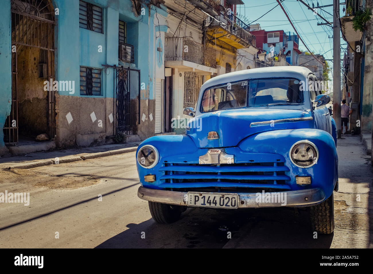 Street Scene with Blue Vintage Classic American Car, Havana, Cuba Stock Photo