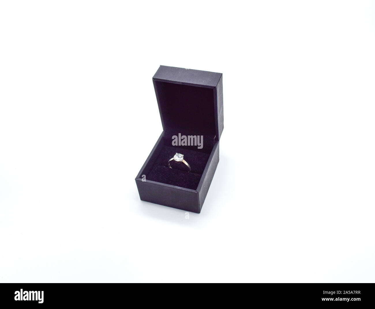 engagement ring in box isolated on white background Stock Photo - Alamy
