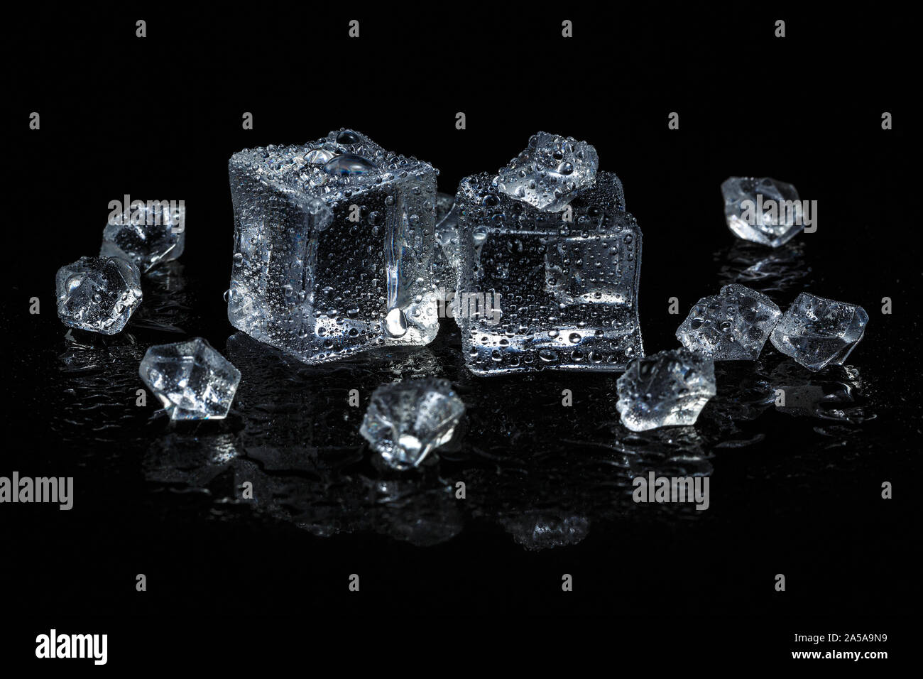 ice cubes on black isolated glass background Stock Photo - Alamy