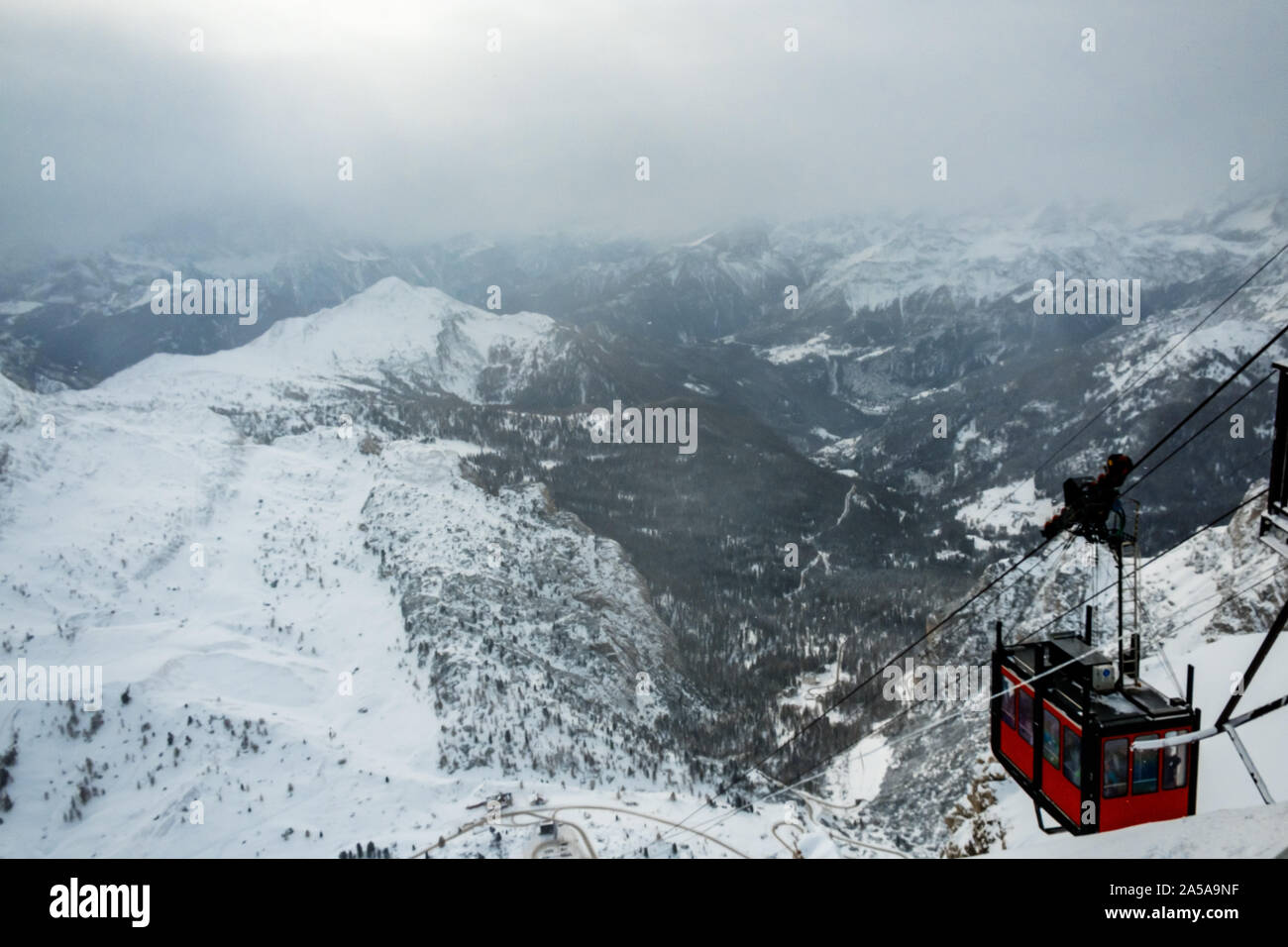 Clouds carrying snow in the italian alps Stock Photo - Alamy