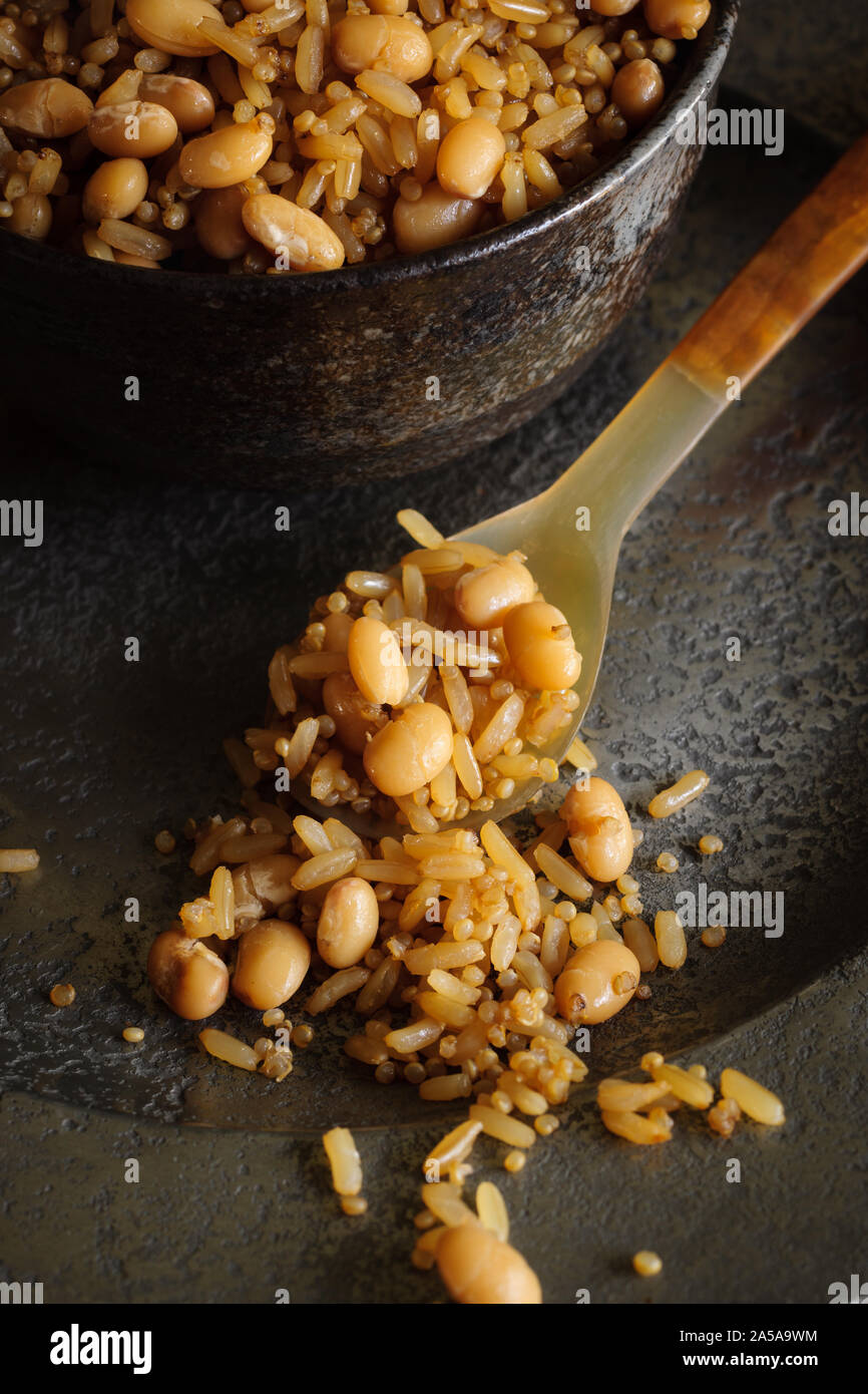 Brown wholegrain rice with haricot beans and Quinoa a healthy high in fiber alternative to white rice Stock Photo
