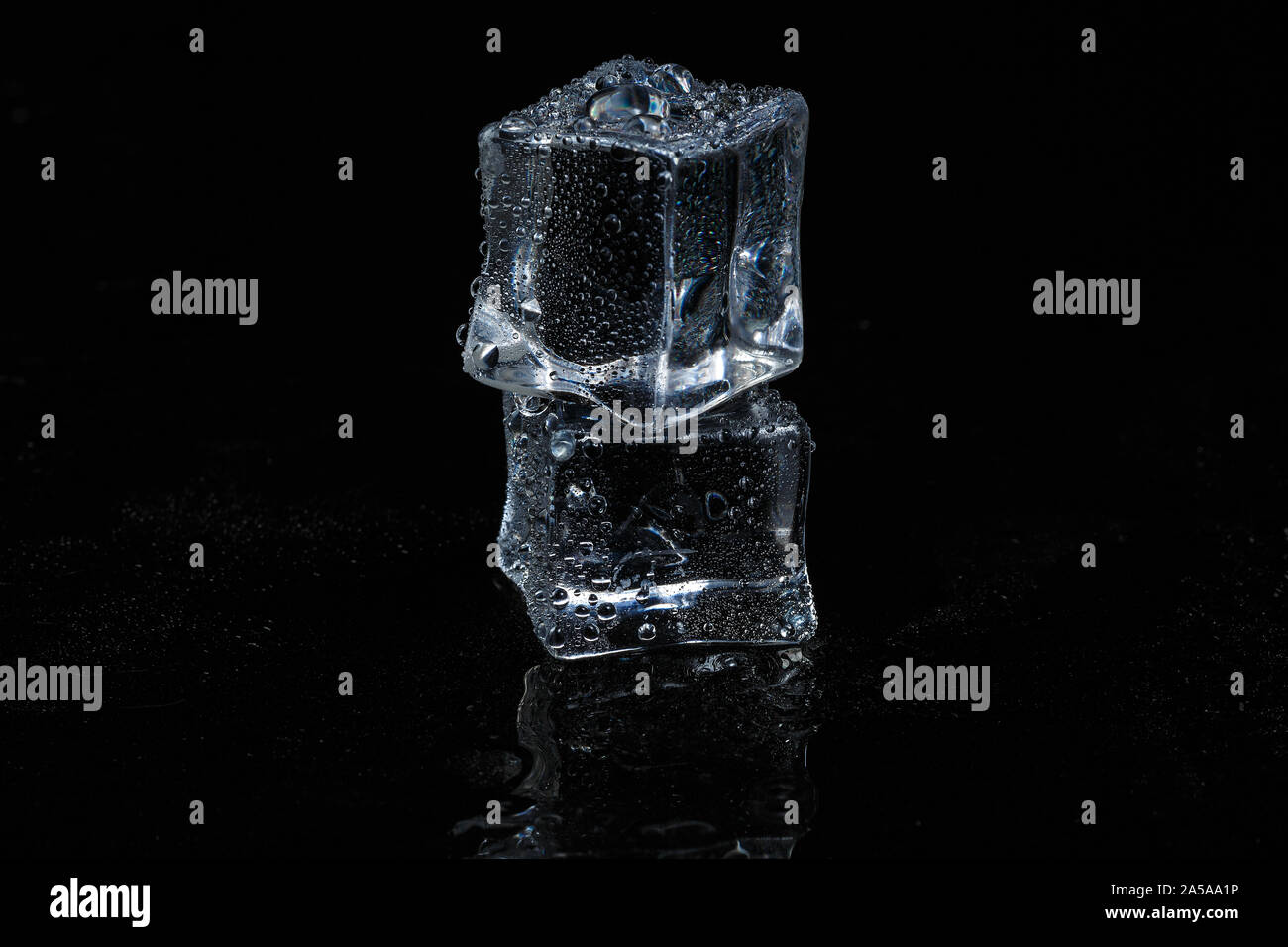 ice cubes on black isolated glass background Stock Photo - Alamy