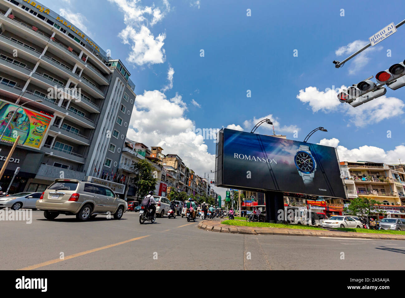 A Romanson brand watch, made in South Korea, is displayed on a large outdoor advertising
