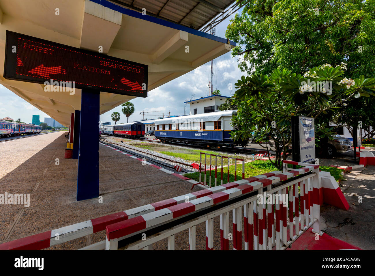 State-owned Royal Railway passenger cars can be seen from the passenger platform of the Royal Railway in Phnom Penh, Cambodia. Stock Photo