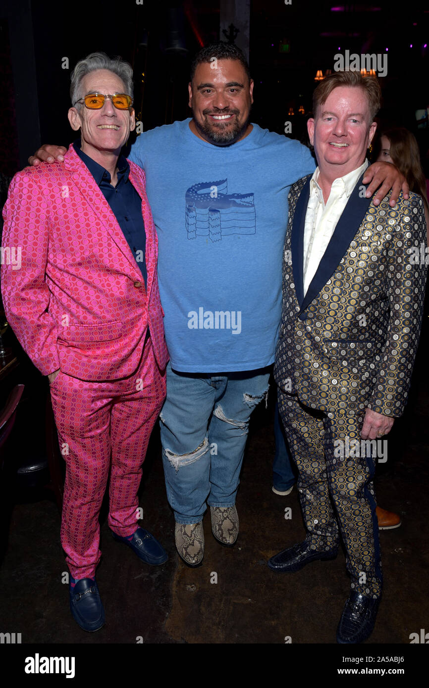 HOLLYWOOD, CA - OCTOBER 10:  Assoiate Producer Marc Kutten, Musician Chris Rudd, and Assoiate Producer John Kelly arrive for the Premiere of High Stru Stock Photo