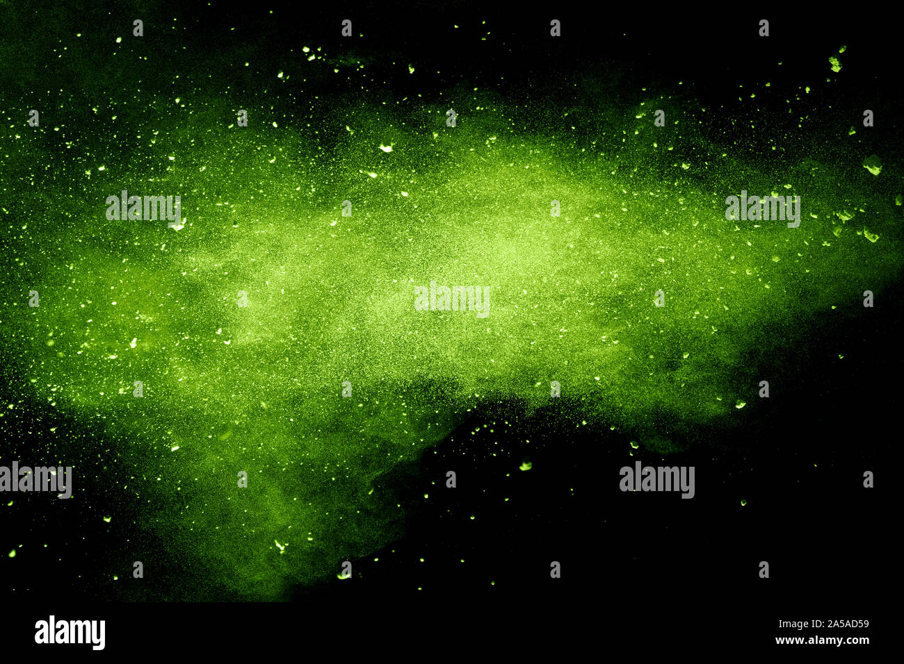 Green powder explosion on black background.Green dust particles splash