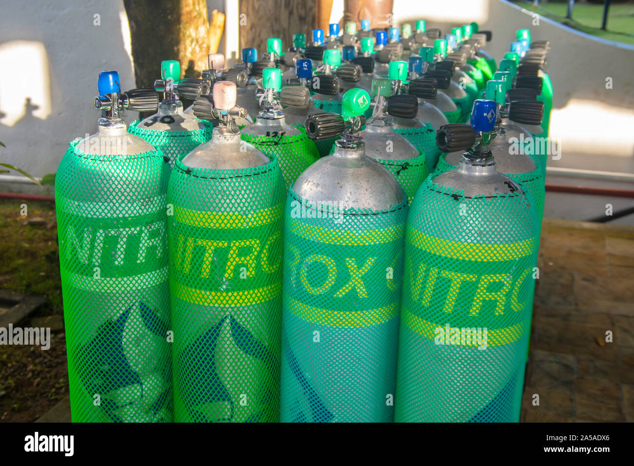 Nitrox scuba diving cylinders lined up at Manta Ray Bay Resort, Yap, Micronesia. Stock Photo