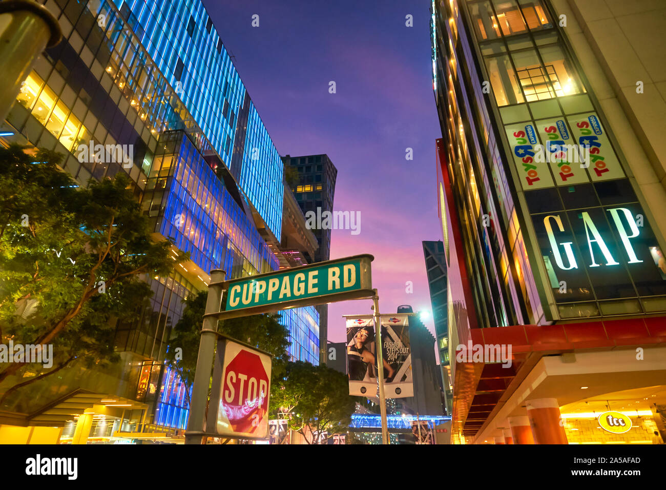 Dusk in Orchard Rd., Singapore, corner Cuppage Rd., Singapore's prime  shopping area, shopping malls & advertisements all lit up for evening  business Stock Photo - Alamy