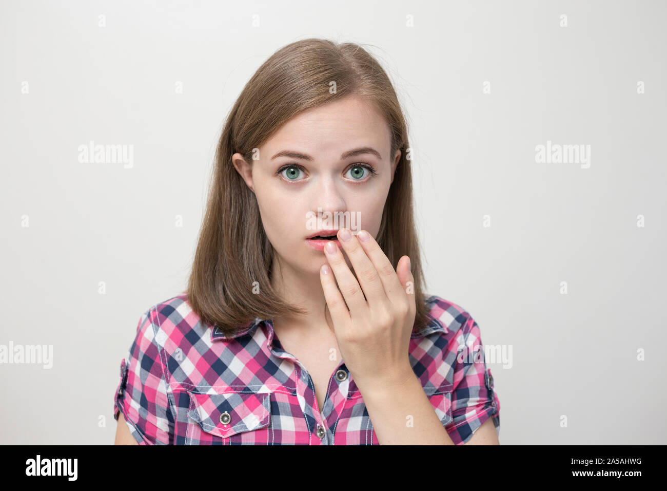 Young caucasian woman girl surprised, scared, shocked; 'Oh my God!' Stock Photo