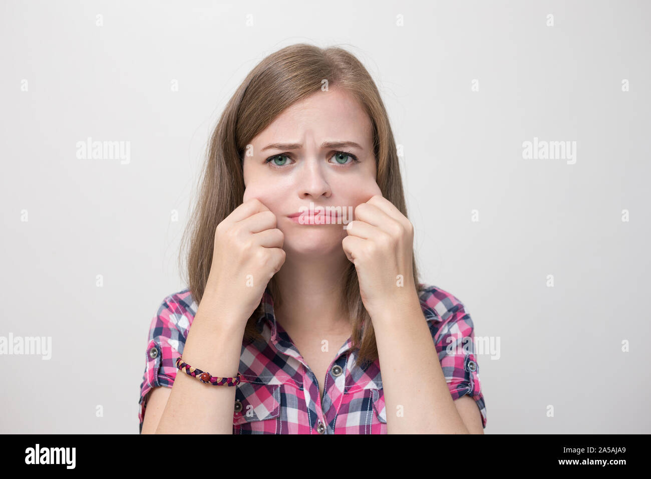 Young caucasian woman girl with chubby fat cheeks Stock Photo