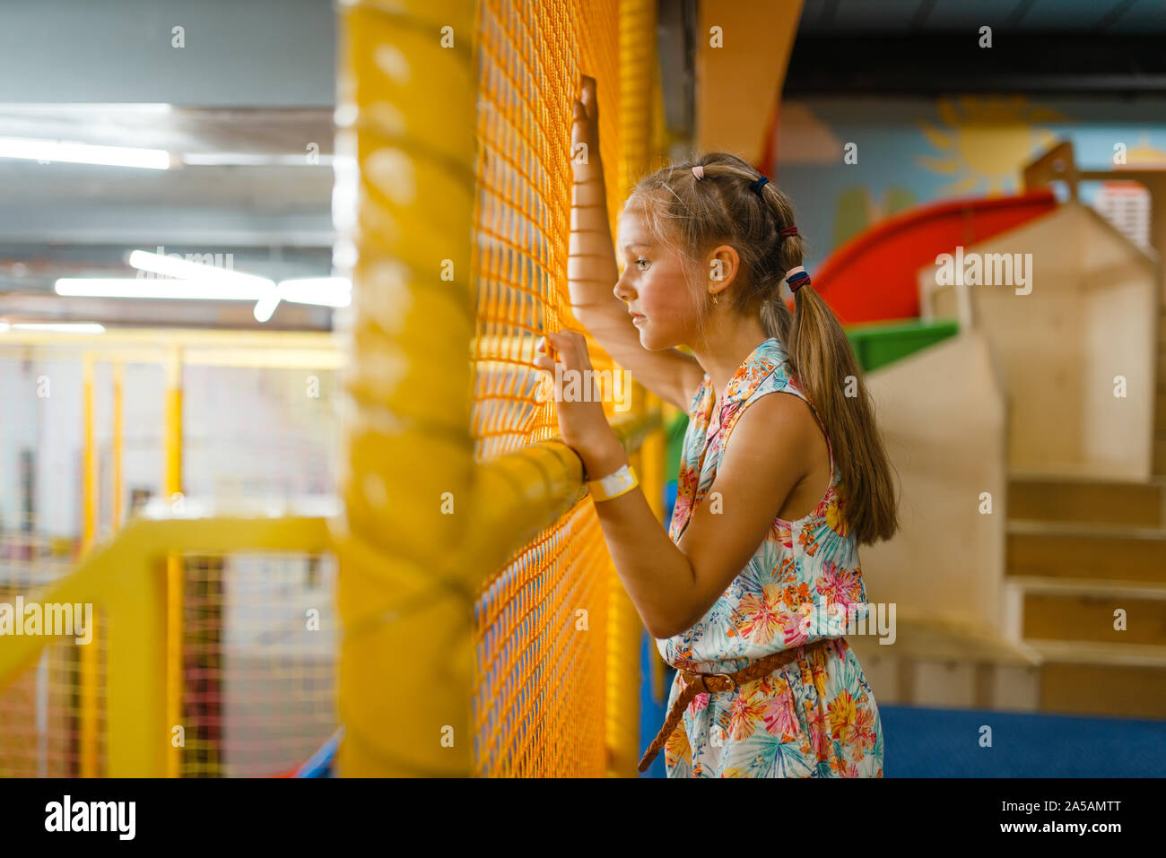 Adorable little girl playing in kids labyrinth Stock Photo - Alamy