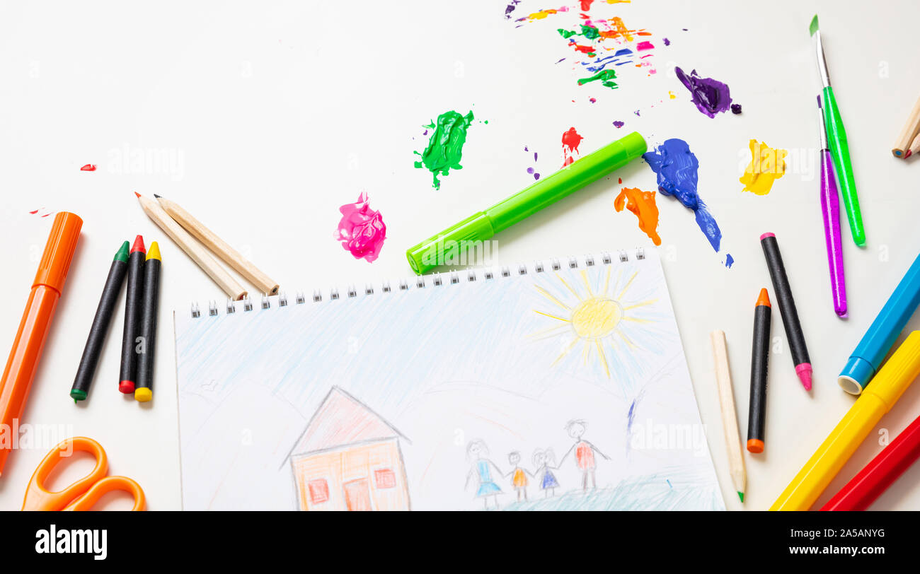 Kids creativity, family home drawing. Colorful paints and drawing on white color background, top view Stock Photo