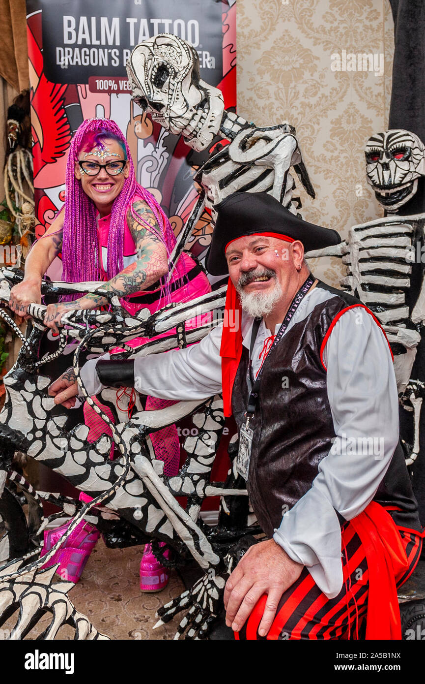 Skibbereen, West Cork, Ireland. 19th Oct, 2019.  Th annual Wild Atlantic Tattoo Show is taking place ths weekend at the Wst Cork Hotel in Skibbereen.  Tattooists from all over Ireland, Europe and the world are in attendance for the duration of the show.  Show organisers Jenny and Aidan McCarthy from Leap at the show. Credit: Andy Gibson/Alamy Live News. Stock Photo