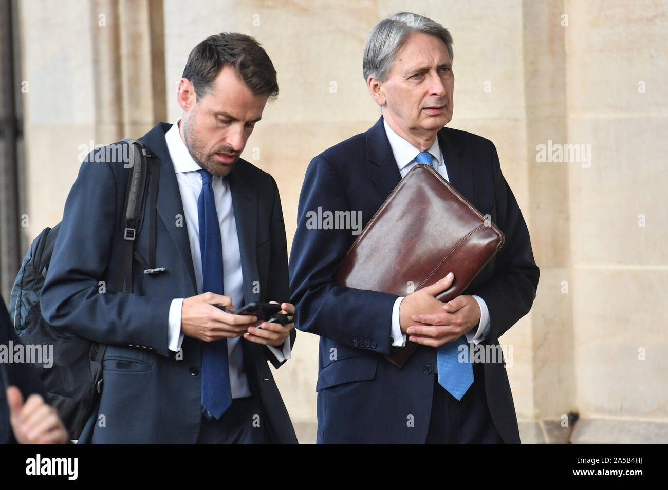Chancellor of the Exchequer Phillip Hammond leavong the House of Commons in London, during an anti-Brexit, Let Us Be Heard rally, after it was announced that the Letwin amendment, which seeks to avoid a no-deal Brexit on October 31, has been accepted Stock Photo