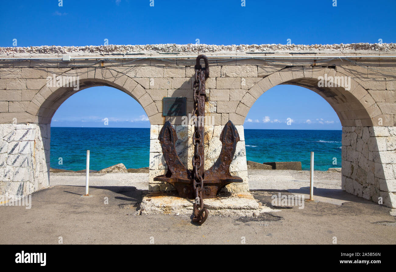 Big old anchor at harbour of Otranto, Lecce, Apulia, Italy Stock Photo