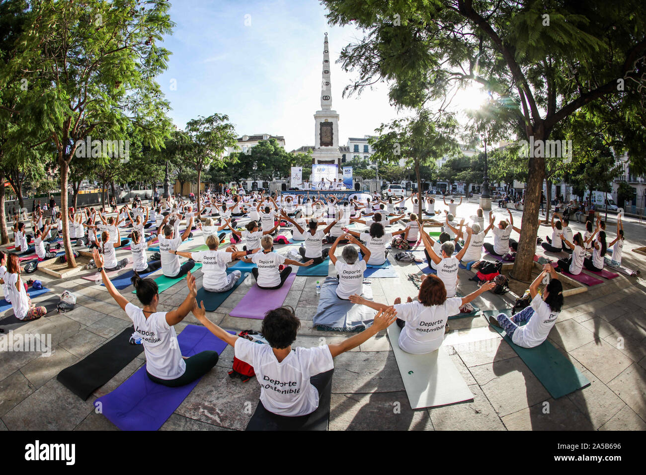 August 4, 2009: 19 october 2019 (Malaga) VI EDITION YOGA IN THE SQUARE. For a responsible use of the public spaces, Take care of your body, take care of your city. Plaza de la Merced hosts the sixth edition of 'Yoga en la Plaza' which, under the motto 'Take care of your body, take care of your city', advocates the responsible use of public spaces, respect for the common good and the practice of responsible and healthy habits, as well as spreading the culture of yoga. This activity, organized by the Malaga City Council through the awareness program 'MÃ¡laga CÃ³mo te Quiero!? ', with the support Stock Photo