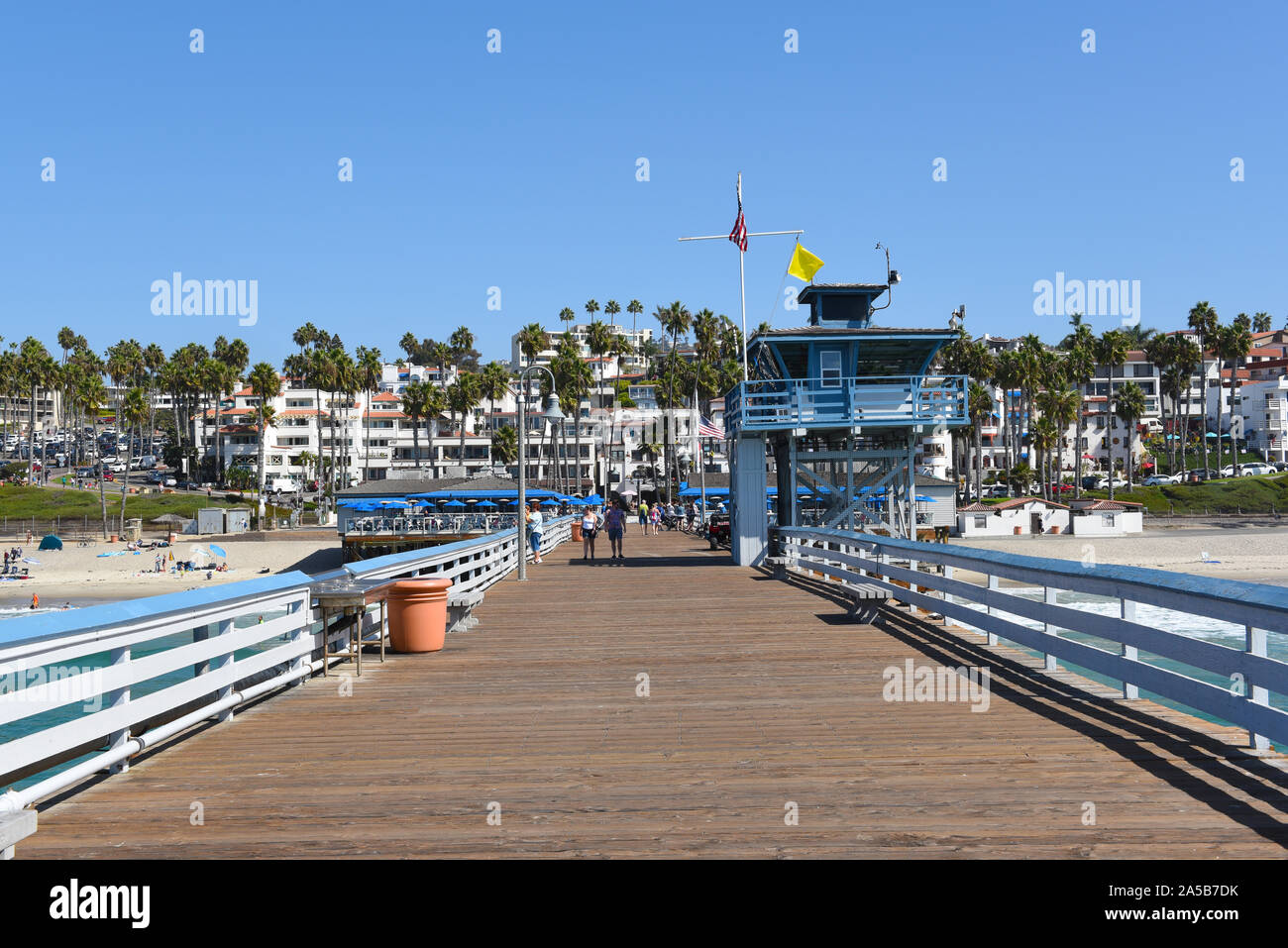SAN CLEMENTE, CALIFORNIA - 18 OCT 2019: The San Clemente Pier Looking towards the beach and homes on the surrounding hills. Stock Photo